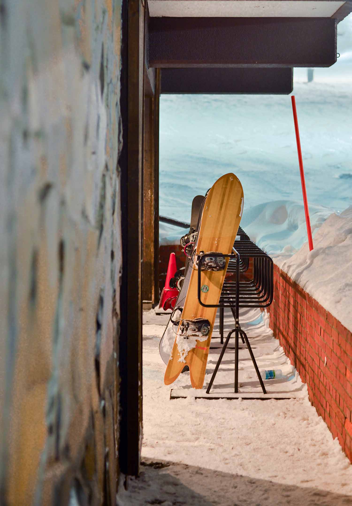 a snowboard leaning against a rack